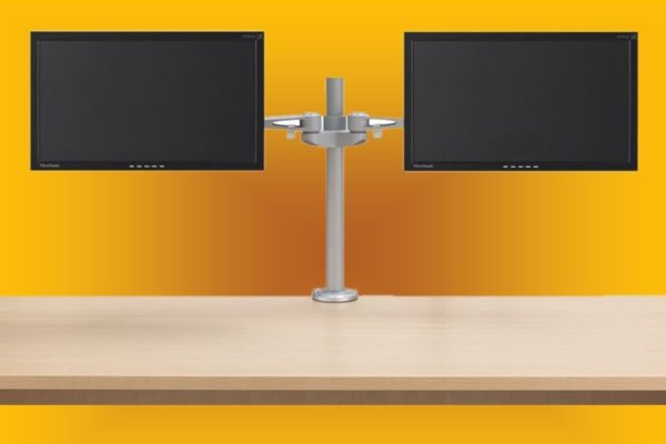 Post style silver clamp-on dual monitor arm with universal mounting system.