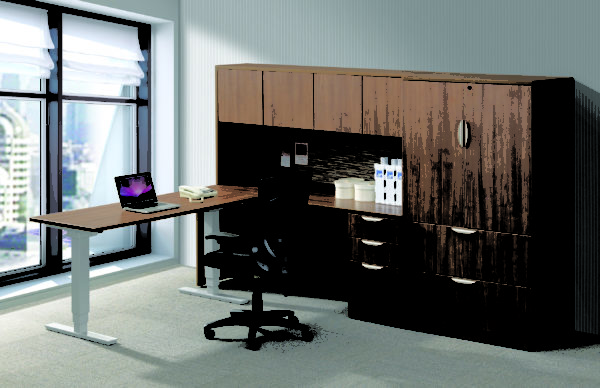 24x60 sit-stand desk combined with medium walnut modular wall storage including, overhead hutch, lateral filing, box box file unit, and mi-height storage cabinet.