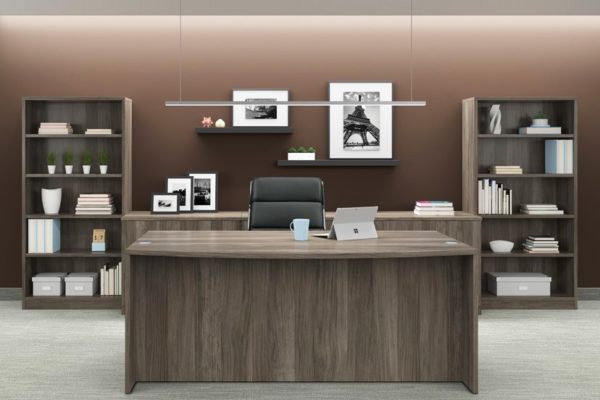 Executive desk with credenza and bookcases in natural walnut laminate.