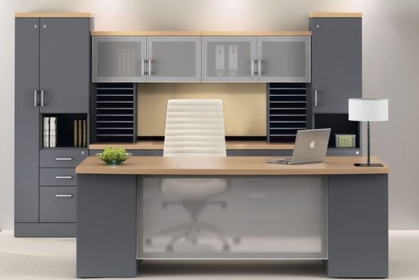 Desk and credenza in grey and maple with glass accents, storage towers, and paper management.