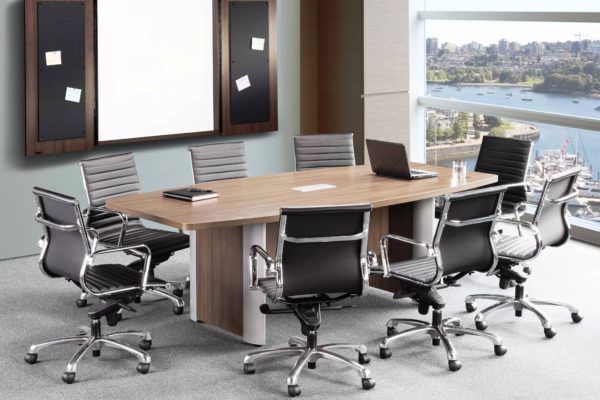 Boat-shaped 48x96 conference table with elliptical aluminum trimmed bases and center power module, finished in modern walnut laminate.