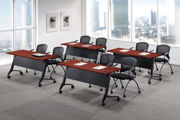 24x48 flip top training tables in classroom layout with black bases, casters, perforated modesty panels with cable management, and medium cherry laminate tops.