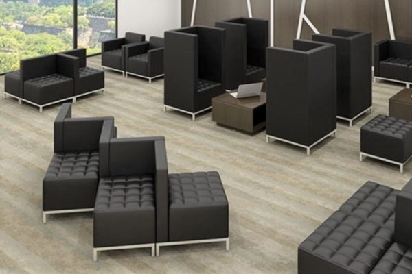 Square modular black open plan waiting room seating ensembles with black simulated leather, tufted seats, individual privacy height wraps, and nickel legs.