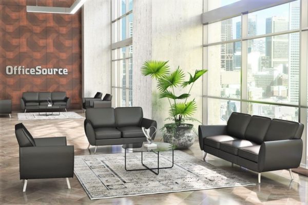 Modern lobby grouping including sofa, loveseat, and club chair with black leather and angled, tapered legs. Accent glass top 36” round coffee table.